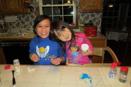 Kasen and Karis making Santa cookies